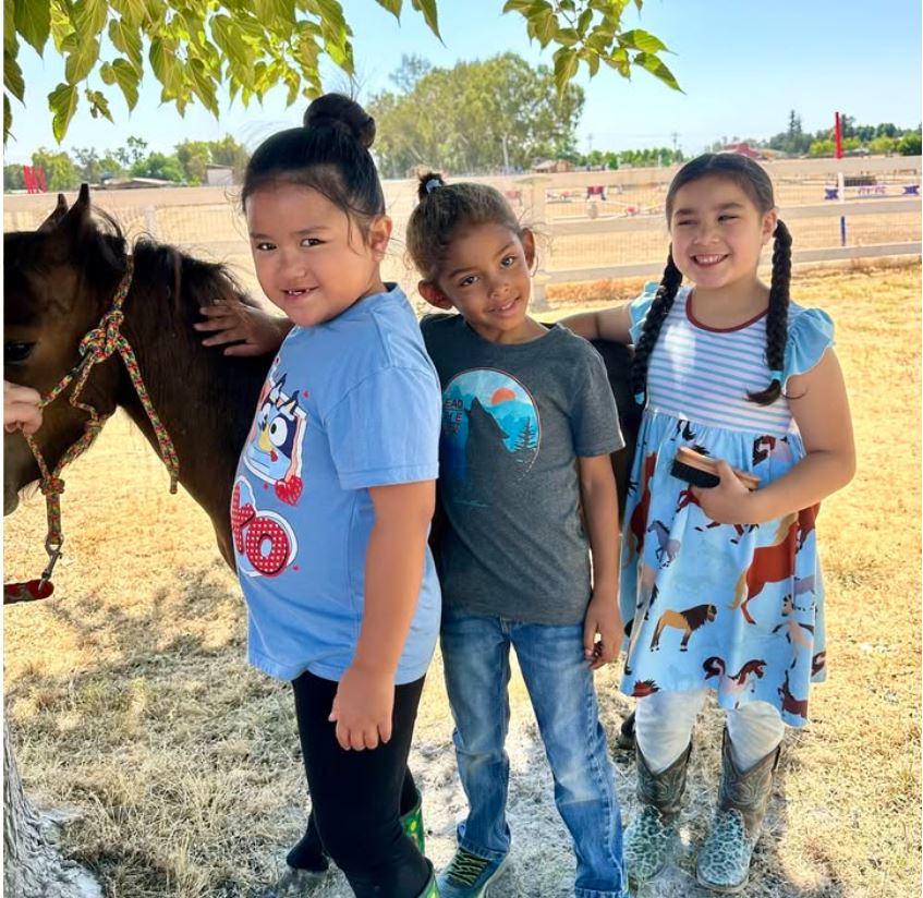 Harvest Moon Horse Rescue Pony Camps petting horse
